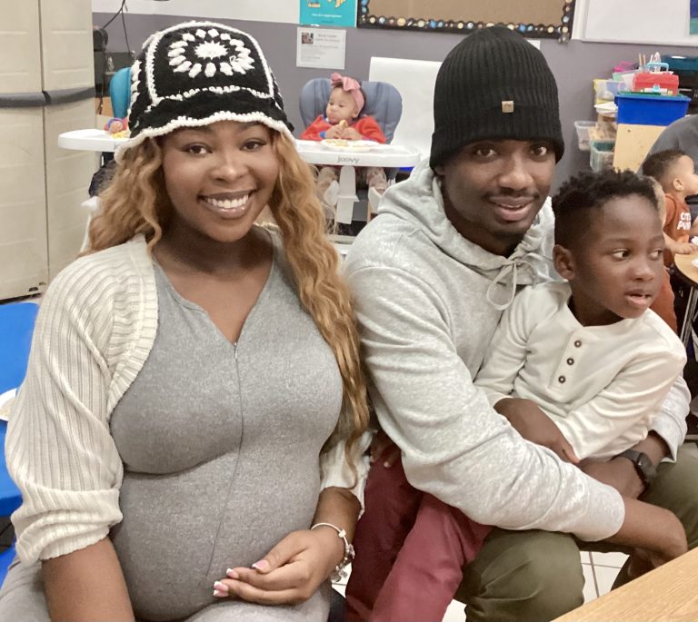 Parents and son at Thanksgiving feast