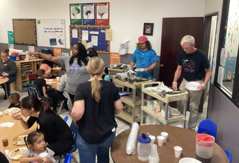 Parents and teachers at Thanksgiving feast