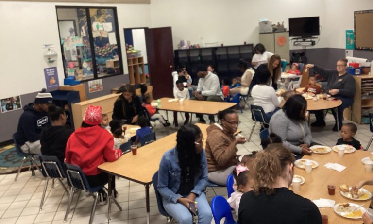 Parents and teachers at Thanksgiving feast