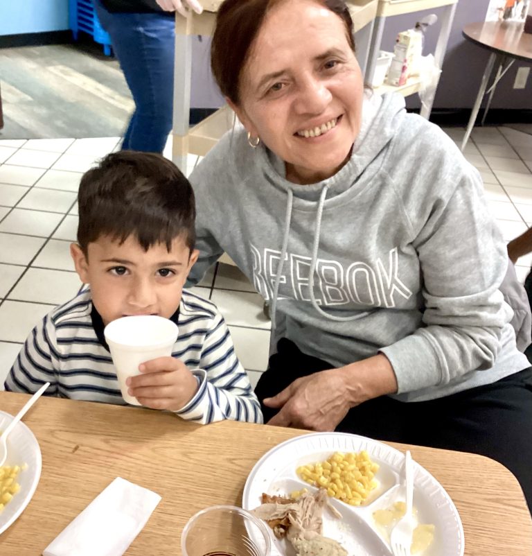 Grandmother and grandson at Thanksgiving feast